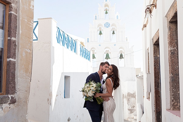 Romantic wedding in Santorini with white flowers and greenery | Alexis & Lee