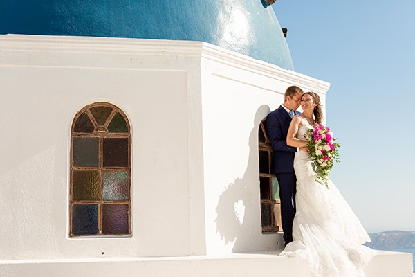 Romantic destination wedding in Santorini with bougainvillea | Corinne & Jon