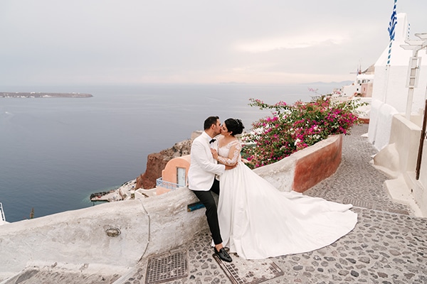 Βloomed fall wedding with a breathtaking view of Santorini island | Antzi & Markos