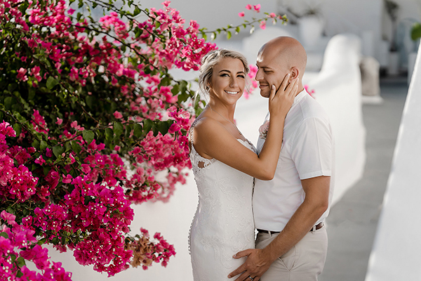 Intimate destination wedding in Santorini with white and pink florals│ Holly & Karl