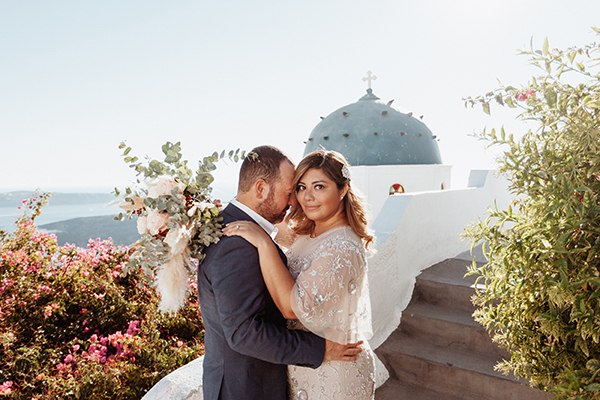An intimate cliffside vow renewal in Santorini with the most beautiful florals│ Heidi & Jose