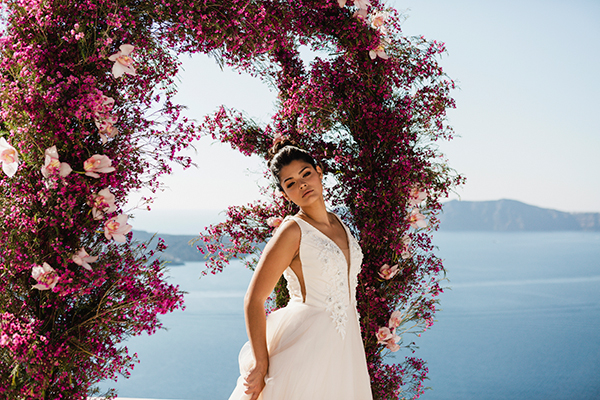 Adorned in bold pink styled shoot in Santorini with gorgeous florals
