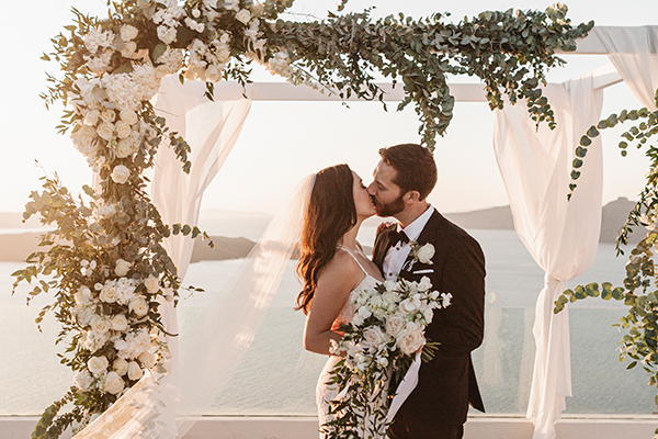 Elegant summer wedding in Santorini with white blooms and gold details│ Maryam & Zach