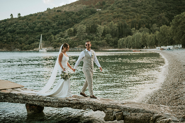 Beach summer wedding in Corfu with white blooms and lush olive leaves │ Sophie & Scott