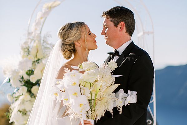 Elegant fall wedding in Santorini with gorgeous white orchids and roses │ Blair & Clayton