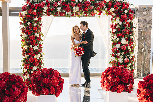 Luxurious red and white wedding in Santorini with stunning florals │ Karen & Matt