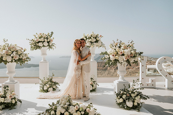Elegant floral-filled wedding in Santorini  | Laura & Roberto